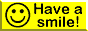 A yellow button with a black smiley face that says ''Have a smile!''